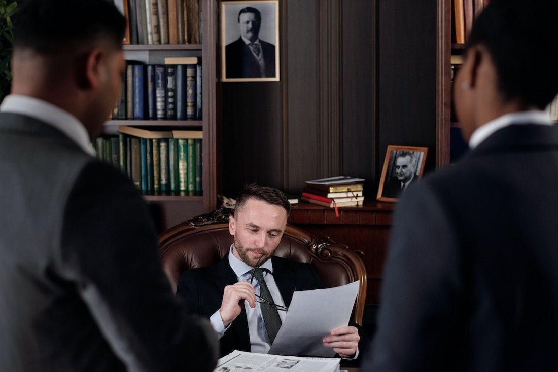 judge reviewing papers in side bar