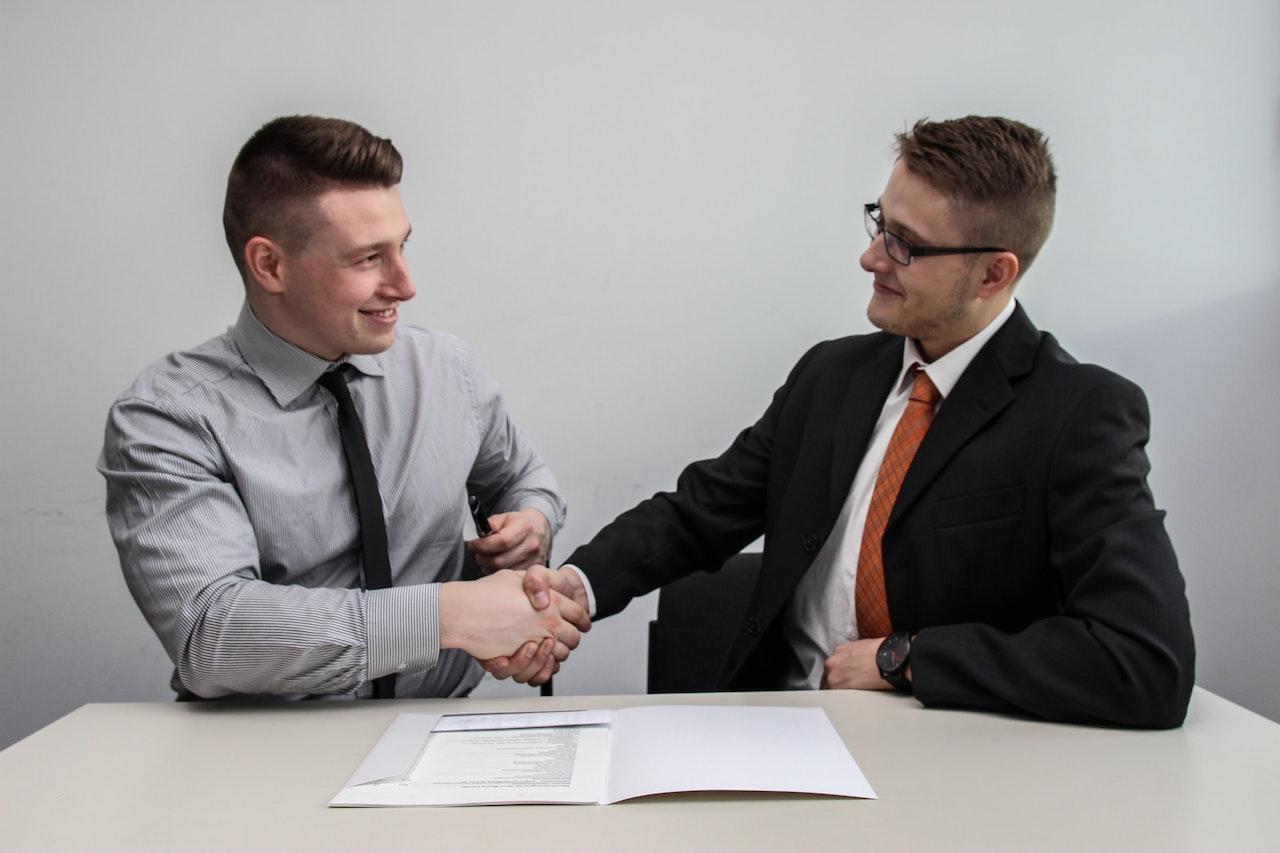 man interviewing and shaking hands