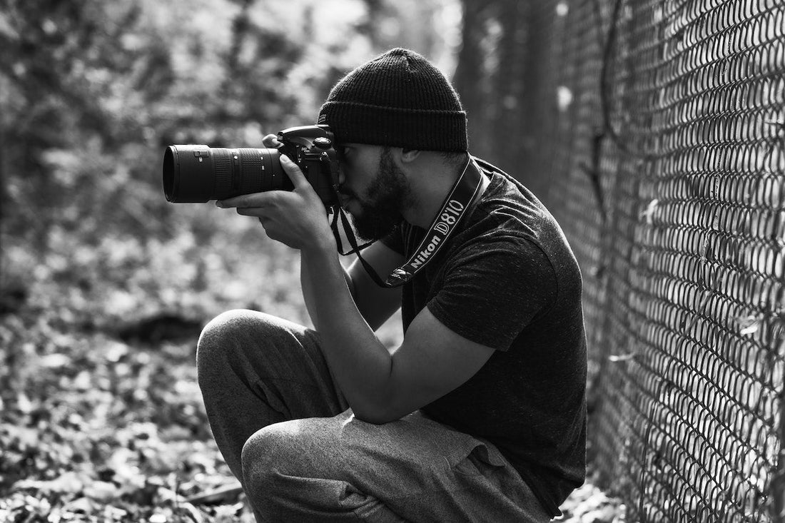 man taking surveillance photos