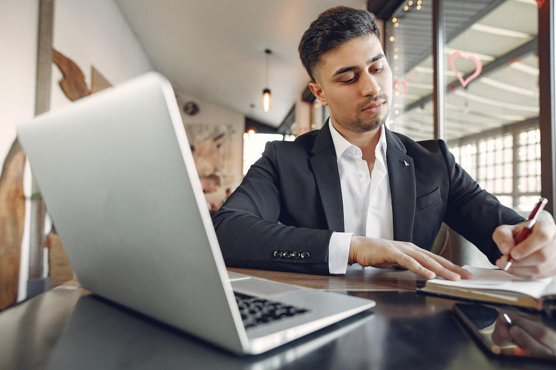 man working on business proposal