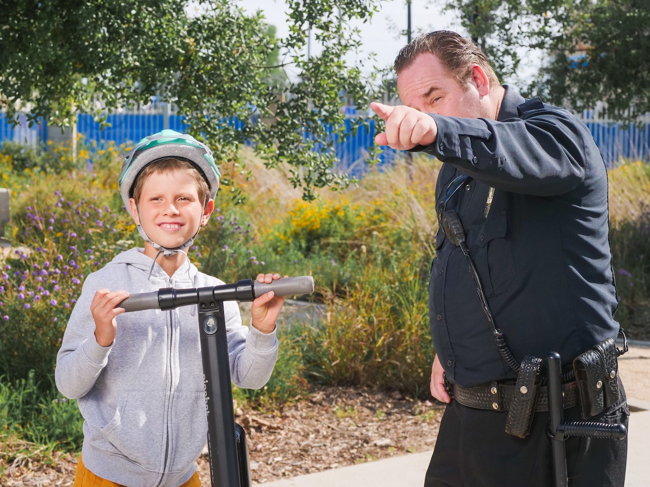 security guard pointing directions to kid