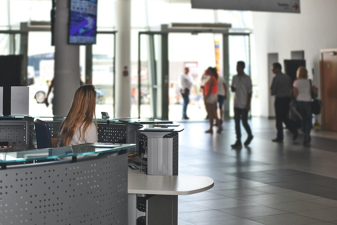 women at front desk busy office
